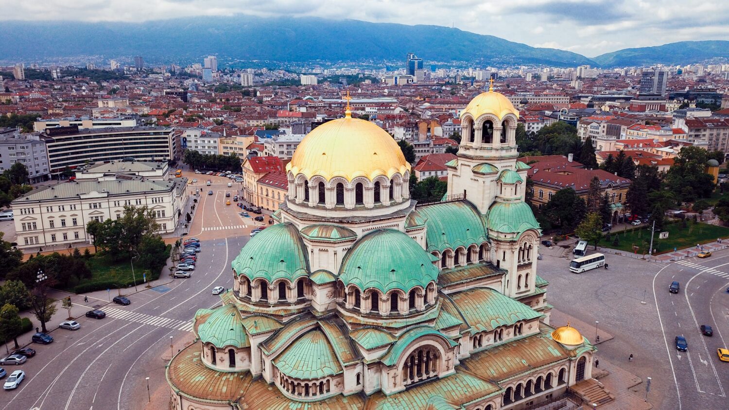 Aerial view of the Alexander Nevsky Cathedral with green and gold domes in Sofia, Bulgaria.