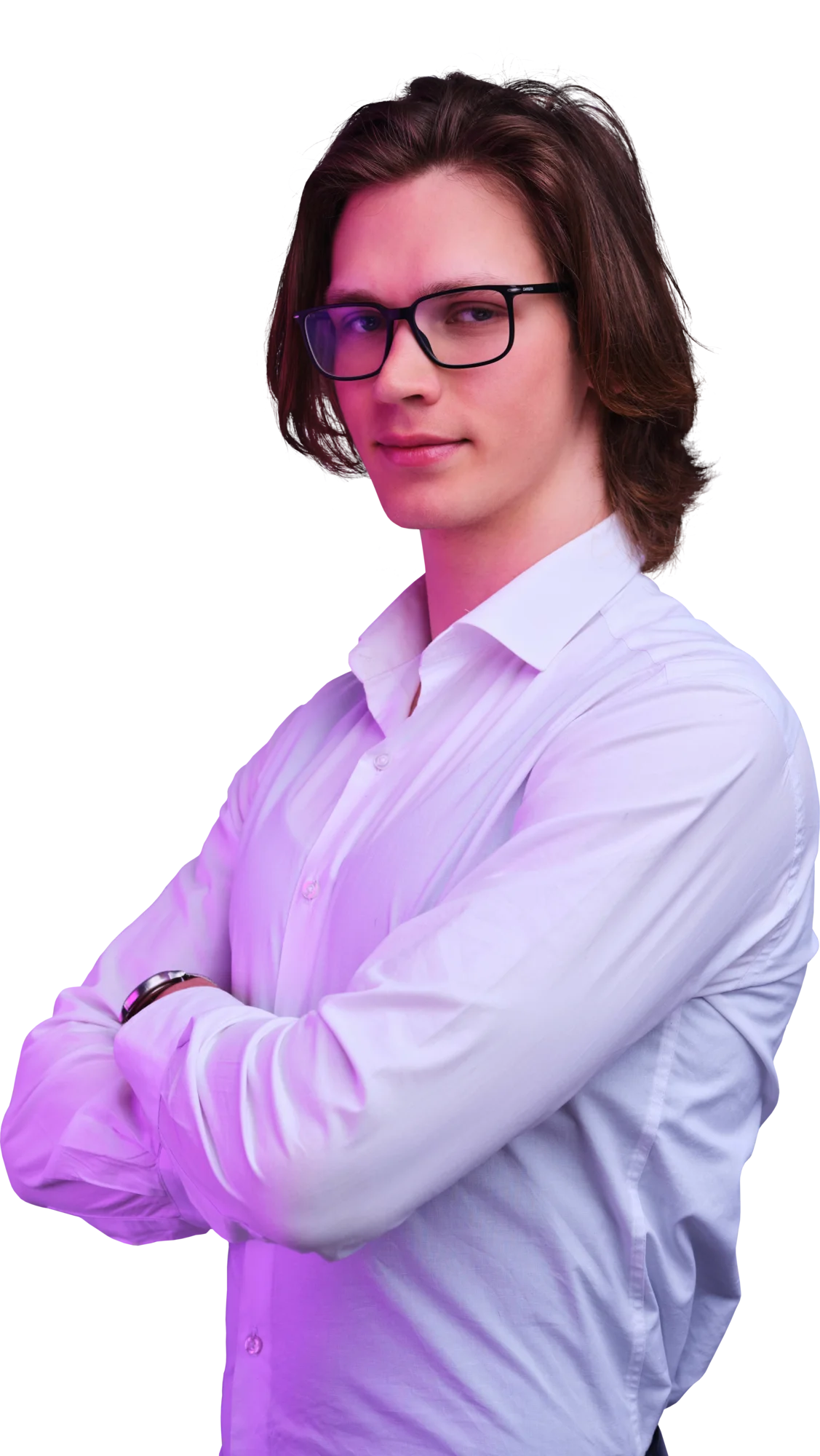 Portrait of a person with brown hair and glasses wearing a light purple shirt, arms crossed.