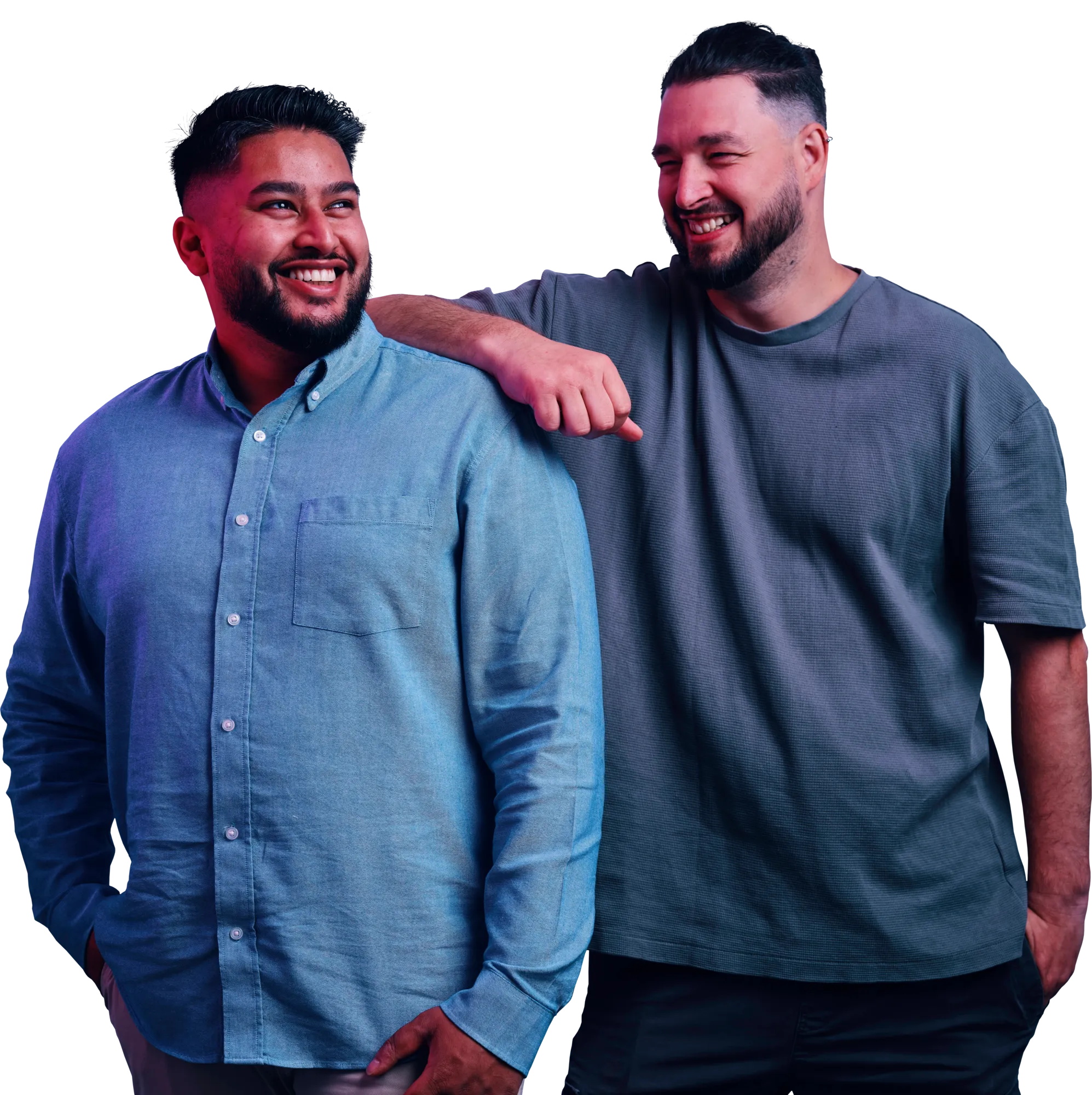 Two smiling men standing together, one with his arm around the other's shoulder.