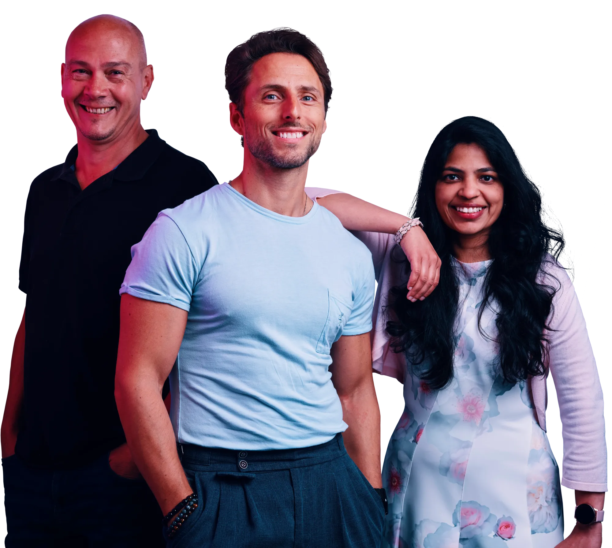 Three smiling people posing together: a man in a light blue shirt in the center, a man in black on the left, and a woman in a floral dress on the right.