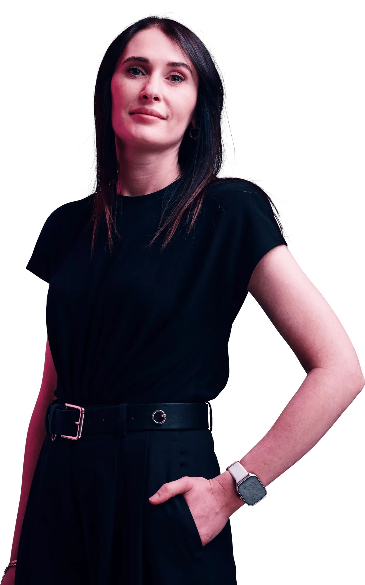 A woman with dark hair wearing a black dress and belt, standing with one hand on her hip.