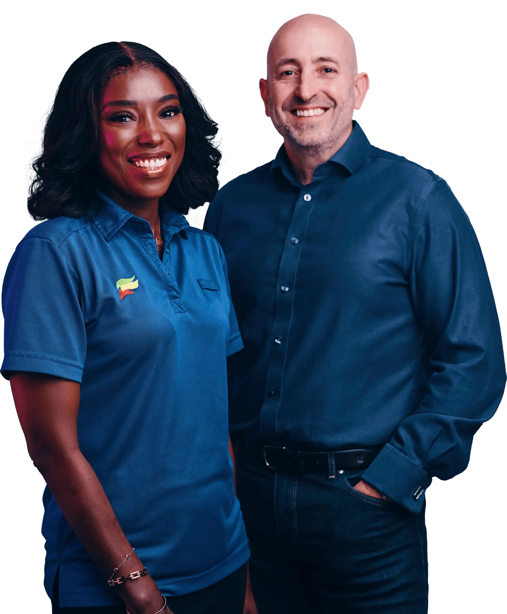 A smiling woman and man stand side by side wearing blue shirts.